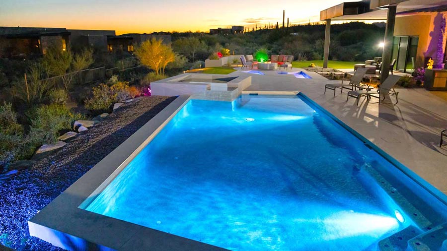 Image of a luxury pool with patio features for outdoor living, built by Southern Arizona Pools in Tucson, AZ